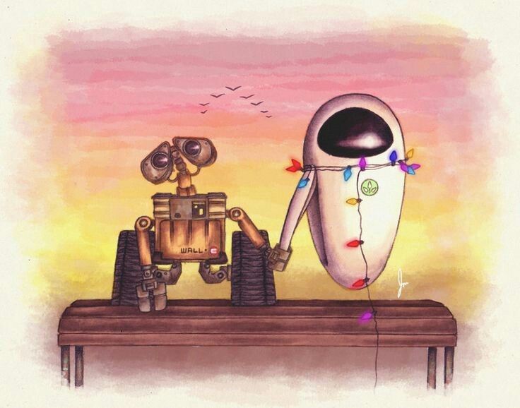 an image of two robots that are sitting on a table with one robot looking at the other