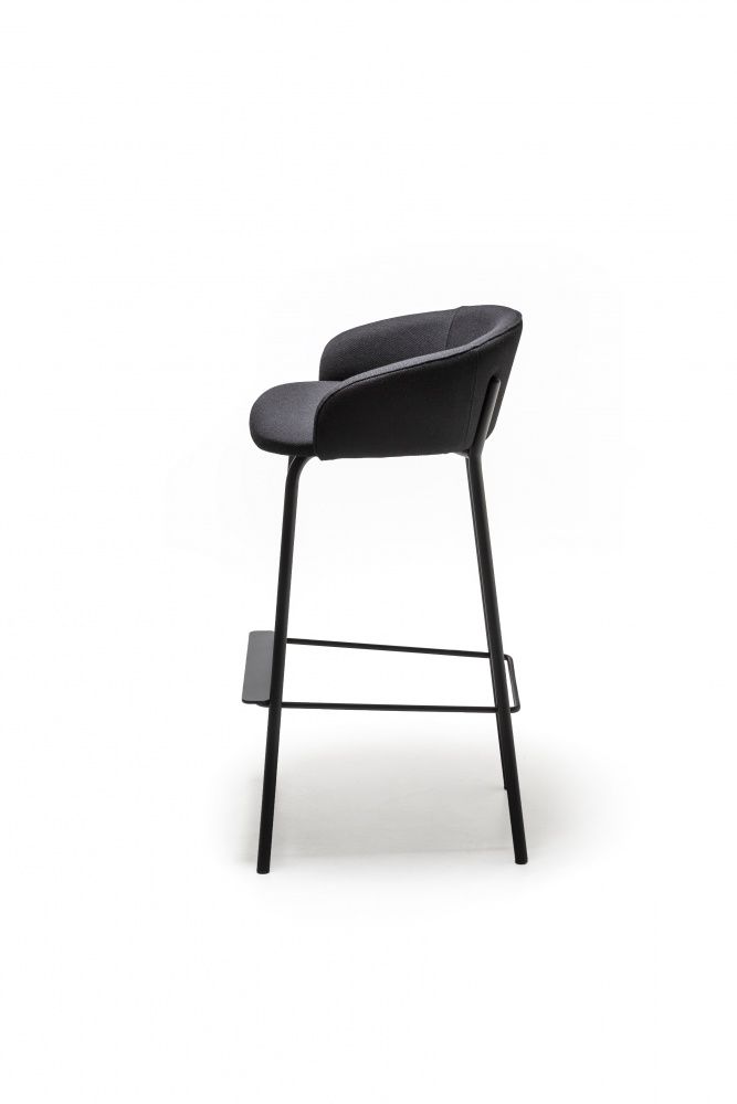 a black stool with an upholstered seat and backrest, against a white background