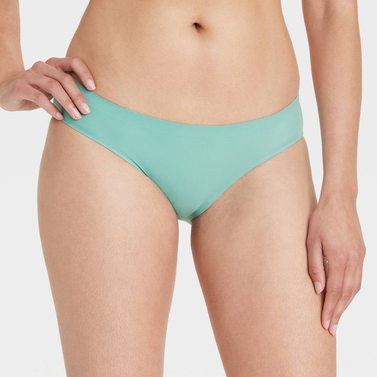 Get a great no-show option for any outfit with this Bonded Microfiber Bikini Underwear from Auden™. This mid-rise bikini underwear features a cotton gusset, bonded edge and lingerie hem, and comes in assorted colors and prints. The bonded microfiber fabric feels soft against your skin, and the added spandex offers you a comfy fit that moves with you as you take on your day. Auden™: Comfort true to every shape & hue. Solid Stretch Tankini Brief, Solid Color Stretch Tankini Brief, Solid Color Stretch Tankini With Briefs, Seamless Tankini Brief For Poolside, Seamless Brief Tankini For Poolside, Seamless Tankini For Poolside, Seamless Stretch Tankini With Briefs, Seamless Stretch Tankini, Fitted Seamless Summer Slip