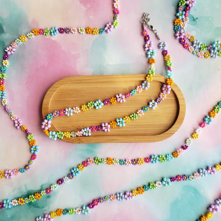 Add a splash of color to your outfit with this handmade rainbow beaded flower necklace! Perfect for teens, preppy styles, or as a unique friendship gift, this necklace features intricate seed bead flowers in vibrant pastel hues. Great for spring, summer, festivals, or daily wear, this accessory is lightweight, adjustable, and versatile. Gift this to your best friend, sister, or yourself! Each necklace is crafted with care, ensuring durability and charm. Pair it with our other cute accessories, l Cute Flower Beaded Necklaces With Colorful Beads, Multicolor Flower-shaped Beaded Necklaces With Tiny Beads, Flower Shaped Beaded Necklaces For Jewelry Making, Cute Flower-shaped Colorful Beaded Necklaces, Multicolor Flower Shaped Beaded Necklace With Tiny Beads, Multicolor Flower-shaped Beaded Necklace With Tiny Beads, Multicolor Flower-shaped Beaded Necklaces, Preppy Rainbow, Jewelry Preppy