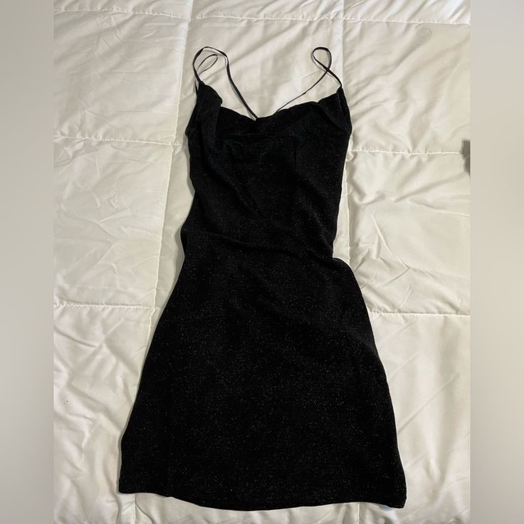 Perfecto Night Out Black Strap Dress With Cross Back Black Fitted Dress For Night, Black Mini Dress For Date Night And Party Season, Black Mini Dress For Date Night Party, Black Mini Dress For Date Night Party Season, Black Mini Dress For Party Season Night Out, Chic Black Mini Dress For Night, Chic Black Night Dresses, Black Strap Dress, Tan Mini Dress