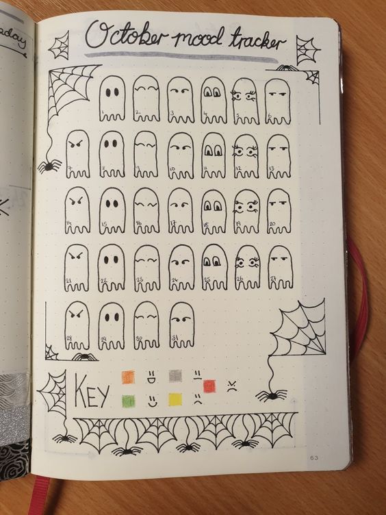 an open notebook with halloween stickers on it