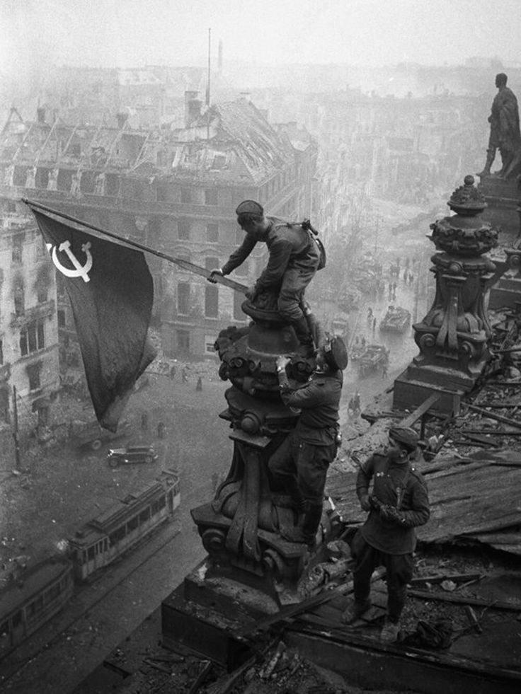 an old black and white photo shows soldiers on top of buildings