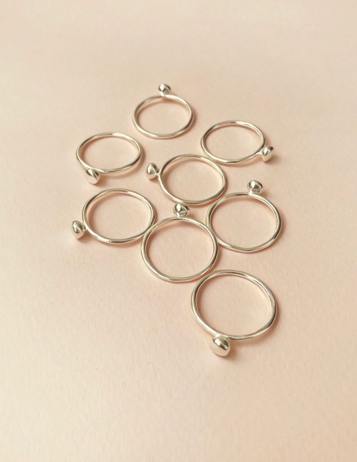 Bell rings, now available in sterling silver | by Studio Baladi Handmade Elegant Midi Rings With Round Band, Dainty Toe Ring Jewelry With Simple Design, Elegant Handmade Midi Rings With Round Band, Handmade Everyday Rings With Round Band, Delicate Handmade Rings For Everyday, Handmade Dainty Round Band Ring, Handmade Minimalist Round Band Rings, Handmade Minimalist Midi Rings With Round Band, Dainty Handmade Round Band Ring