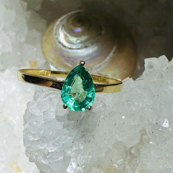 A beautiful natural earth mined emerald set in a solid 18K yellow gold setting. Marked 18K Gold Teardrop Emerald Ring, Yellow Gold Teardrop May Birthstone Ring, Gold Teardrop Emerald Promise Ring, Yellow Gold Teardrop Ring For May Birthstone, Green Teardrop 14k Gold Ring, Pear-shaped Emerald Jewelry In Yellow Gold, Green Emerald Teardrop Rings, Green Teardrop Emerald Rings, Green Pear-shaped Emerald Ring