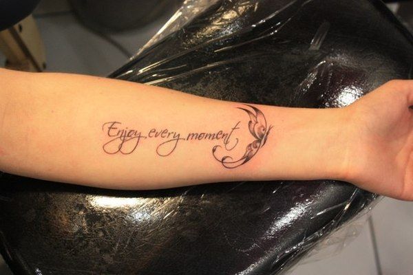 a woman with a tattoo on her arm that reads, eyes open, memorys