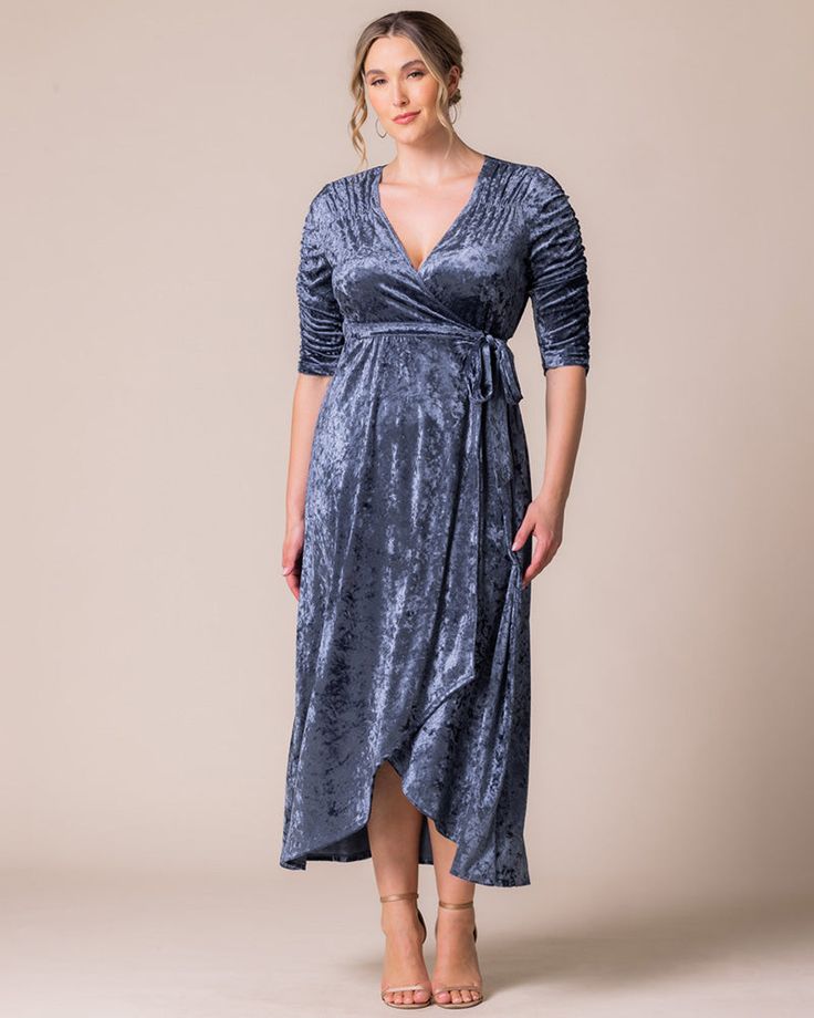 Our Cara Velvet High Low Wrap Dress exudes luxury with its rich, crushed velvet fabric and vintage-inspired ruching at the neckline and sleeves. The hi-low hemline adds movement, showing just a hint of skin for a chic touch. Perfect for the best dressed wedding guest, or when the invite calls for holiday, formal, or semi-formal attire. This elegant plus size special occassion maxi dress is designed exclusively for curvy figures.