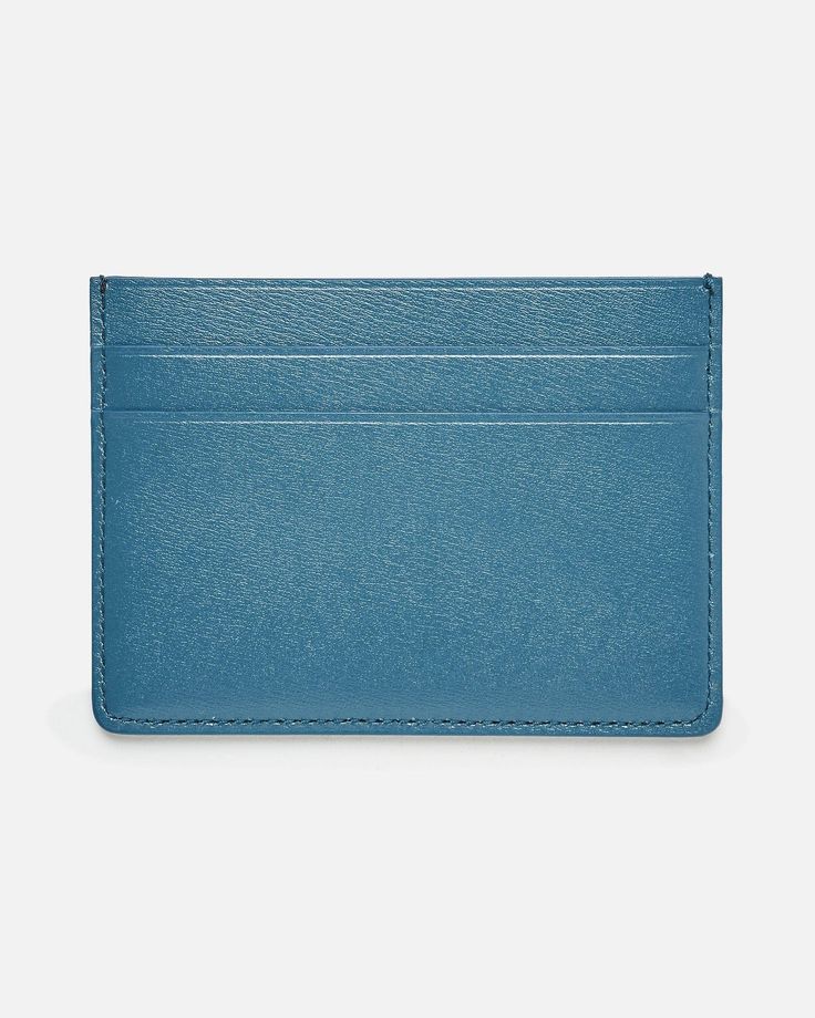 Jil Sander card holder in blue. This leather card holder features two card slots on the front and two on the back. There is a foil logo embossed detail on the front. Two card slots at front Two card slots at back One flat pocket Foil embossed logo on front Classic Blue Card Holder For Business, Classic Blue Business Card Holder, Classic Blue Wallets With Card Slots, Classic Blue Wallet With Card Slots, Classic Blue Card Holder For Everyday Use, Classic Blue Card Holder For Daily Use, Blue Classic Card Holder For Everyday Use, Blue Classic Card Holder For Daily Use, Blue Elegant Card Holder With Rfid Blocking