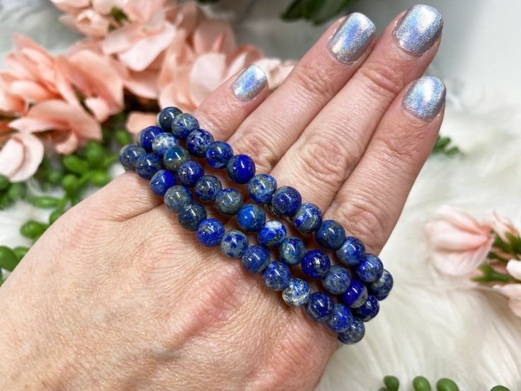 Blue Lapis Lazuli Stretch Mala Beaded Bracelet Luxury Lapis Lazuli Bracelets, Adjustable Blue Spiritual Bracelets, Spiritual Evil Eye Bracelet With Gemstone Beads As Gift, Symbolic Healing Bracelets With Round Beads, Adjustable Sapphire Spiritual Bracelet, Spiritual Sapphire Beaded Bracelets Hand-strung, Spiritual Sapphire Beaded Hand-strung Bracelet, Spiritual Sapphire Hand-strung Beaded Bracelets, Sapphire Lapis Lazuli Bracelets As Gift