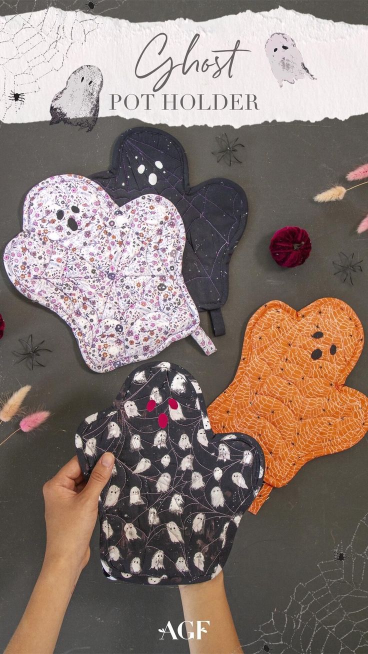 someone is making halloween ghost pot holders out of fabric