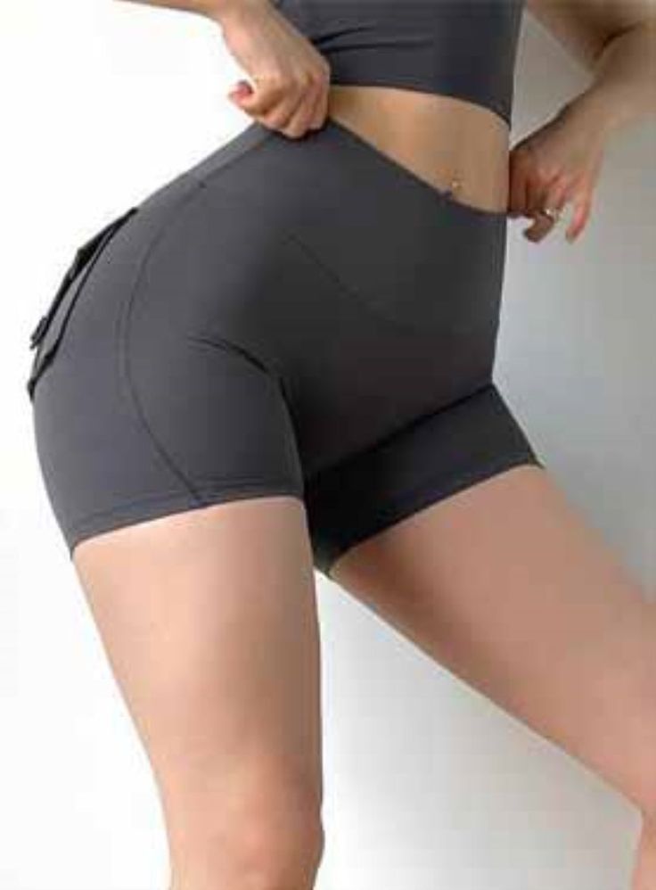 Material:95%Polyester+5%Spandex -Comfy and stylish, enjoy this Yoga Shorts all summer long. They have a high-waist, and give you a comfortable fit thanks to its elasticity.  -Keep your valuables secure with the fashionable and breathable side pockets that are roomy enough to put your essentials. The cute and practical design gives you a feel of wearing shorts underneath your clothes as if you`re not wearing anything. -You'll love the comfortable material, high waist and pockets of our Summer Hig Workout Pants Women, Peach Shorts, Fitness Shorts, Sports Shorts Women, Hip Lifts, Women's Workout, Fitness Apparel, Sports Running, Womens Workout Outfits