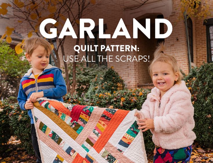 two young children holding up a quilt in front of a brick building with the words garland quilt pattern use all the scraps