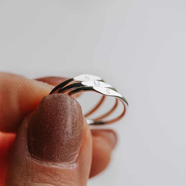 A Dainty Tiny Signet Ring, customised with a letter/initial of your choosing. The perfect ring for stacking! Each letter is hand stamped in our 1.5mm tiny block font (uppercase only). Available in sizes 2 US to 15 US Need help with sizing? Look at our size guide or purchase our ring sizer Due to its handmade nature, there may be some colour variances where the solder seam is Each Stamp + Shine piece is made from scratch in our little studio in Melbourne, Australia. The process begins with a clea Signet Ring Silver, Clean Metal, Block Font, Silver Signet Ring, How To Clean Metal, Metal Sheet, Made From Scratch, Ring Sizer, Silver Pieces