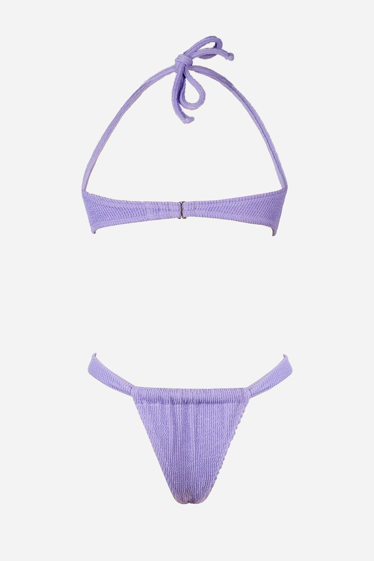 Make a bold statement with our Amethyst Bikini Top & Extra Cheeky Bottoms Set. With its vibrant purple hue, this set is perfect for adding a pop of color to your beach look while the extra cheeky bottoms add a sexy touch. Product Code: CAA12A4E175VV/CAA12B4E175VV Features:  Crinkle fabrication Halterneck No cups Light bust support Back tie & hook closure Low-rise waist High-leg cut Extra cheeky bum coverage Regular wash Materials: 95%POLYESTER, 5%SPANDEX Lining: 92%POLYESTER, 8%SPANDEX. Purple Halter Neck Swimwear For Beach, Poolside Purple Halter Neck Swimwear, Purple Halter Neck Swimwear For Summer, Summer Halter Neck Purple Swimwear, Purple Halter Neck Swimwear For Pool, Purple Halter Neck Swimwear For Beach Party, Lavender Stretch Swimwear For Beachwear, Purple Triangle Top Swimwear For Poolside, Summer Lavender Swimwear For Swimming