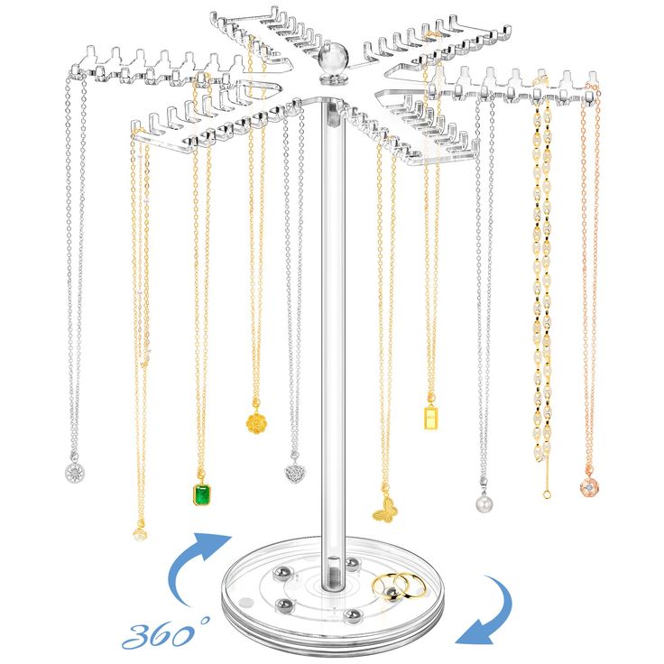 a jewelry stand with many different necklaces hanging from it's sides and an arrow pointing