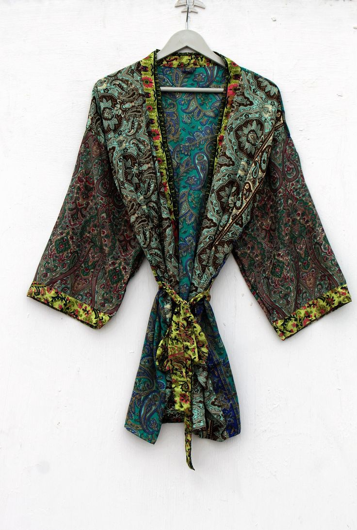 Vintage Polysilk kimono,Upcycle Polysilk Short kimono,Silk Kimono Jacket, Cardigan Duster Jacket, Kimono Bohemian Jacket, Short Kimono, Note This is Not Pure Silk kimno This Kimono is Mix Silk 40% Silk 60% Polyster Elegant Kimono light weight, soft Indian Blended Silk Fabric An all-rounder for every wardrobe The perfect outfit for the next dinner party, a summer day by the sea or just a cozy day at home. Measurements One size fits all. (S-M-L-XL-XXL) Free Size Color: As per picture Short Kimono Silk Long Sleeve Home Robe, Long Sleeve Silk Robe For Home, Long Sleeve Silk Robe, Bohemian Robe With Kimono Sleeves In Green, Green Bohemian Robe With Kimono Sleeves, Vintage Green Kimono For Festival, Green Wrap Kimono For Festival, Green Vintage Kimono For Festival, Long Multicolor Silk Kimono