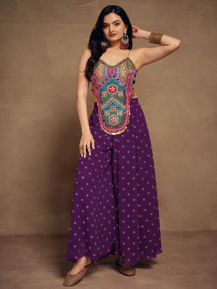 Our exquisite purple georgette palazzo is adorned with intricate threadwork. This palazzo exudes sophistication and charm, with its flowing silhouette and rich purple hue. Crafted from high-quality georgette fabric, it promises both comfort and style, making it a perfect choice for various occasions.
Complementing this palazzo is a stunning multi-color art silk crop top, meticulously embellished with beads work, threadwork, and handwork. The vibrant colors and exquisite detailing add a touch of Purple Georgette Palazzo Set For Party, Festive Purple Palazzo Set, Embroidered Purple Palazzo Set For Festivals, Semi-stitched Purple Georgette Palazzo Set, Semi-stitched Purple Palazzo Set With Intricate Embroidery, Anarkali Lehenga Gowns, Lehenga Crop Top, Anarkali Lehenga, Lehenga Choli Wedding