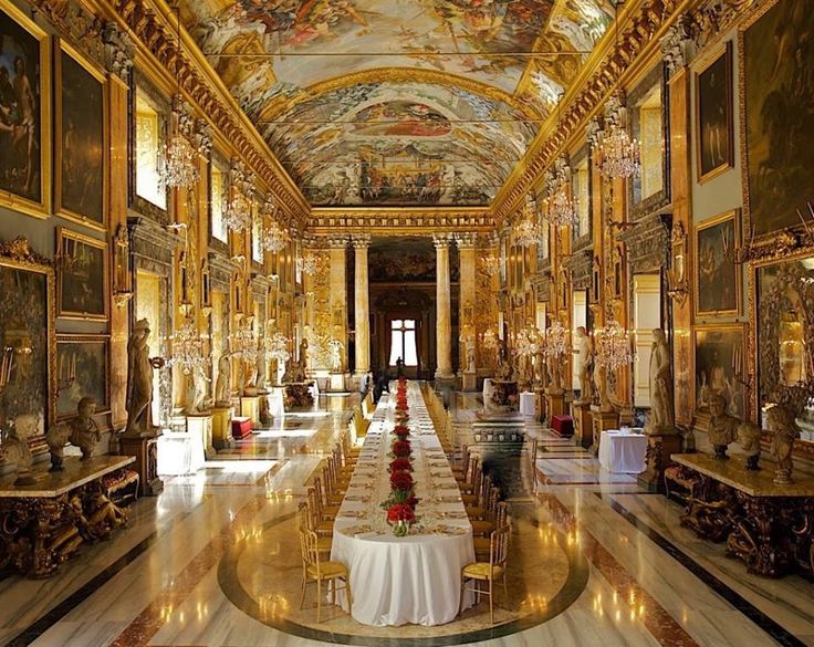 an elaborately decorated hall with tables and chairs