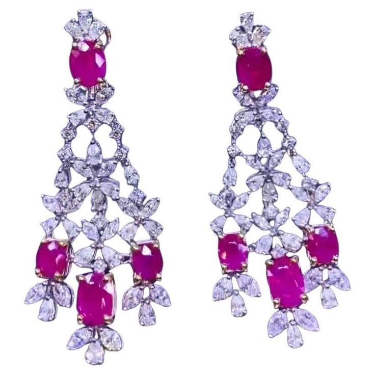 An exclusive pair of earrings in refined design, so beautiful and particular, a very master piece. Earrings come in 18k gold with 8 pieces of natural Burma Rubies in perfect oval cut, extra fine quality, spectacular color , of 11,08 carats, and natural diamonds in special cut of 7,83 carats, F color and VS clarity, top selection. Handcrafted by artisan goldsmith. Excellent manufacture and quality of stones. Complete with AIG report. Whosale price. Note: on my shipment, no taxes. For European customers, I have available shipment from Italy. Red Gems, 18k Gold Earrings, Master Piece, Dream Jewelry, Earrings Collection, Chandelier Earrings, So Beautiful, Oval Cut, Natural Diamonds