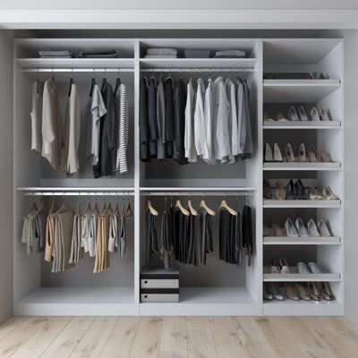 a walk in closet with lots of clothes and shoes on the shelves next to it