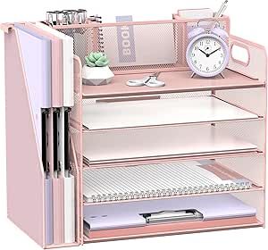 a pink desk with drawers and an alarm clock on the top shelf, in front of a white background