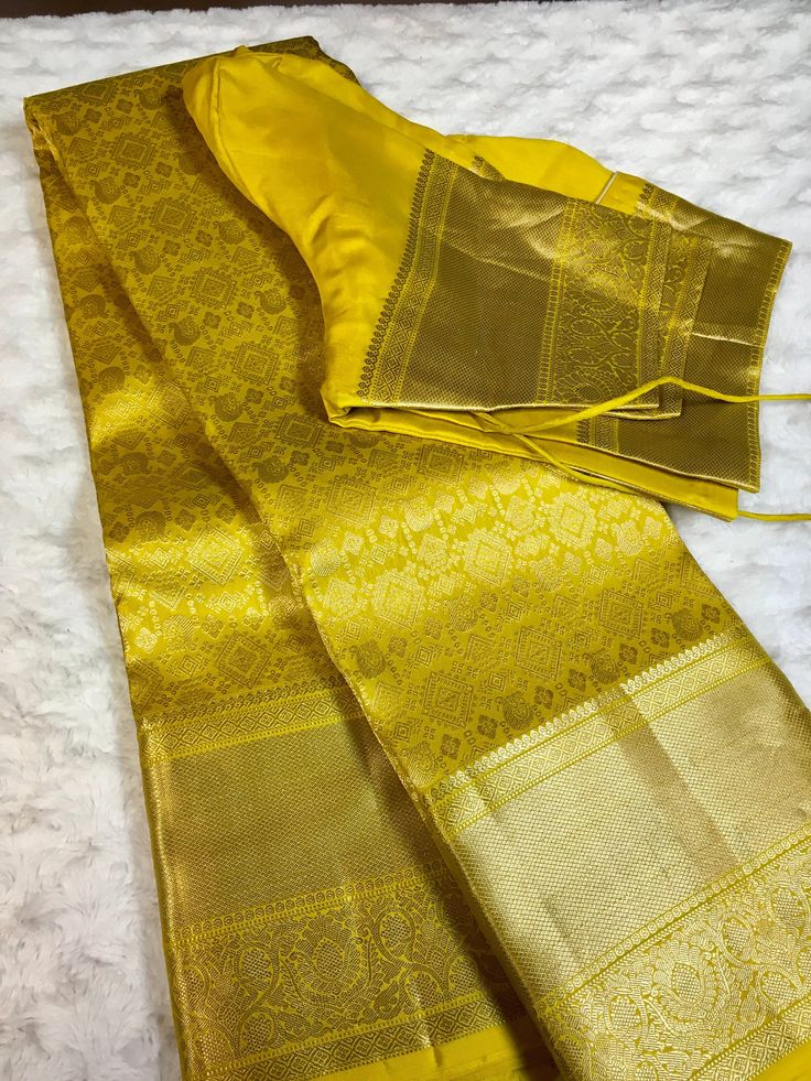 Indulge in luxurious elegance with this Golden yellow kanchipuram silk saree. This saree features a stunning geometric design in a rich golden yellow color, crafted from premium kanchipuram silk. Elevate your wardrobe with this exquisite piece, perfect for any special occasion. This saree is ready to wear with fall and pico done. Comes with stitched blouse - size: 38-46.  SILK MARK CERTIFIED Mustard Kanjeevaram Saree, Elegant Katan Silk Churidar For Festivals, Gold Traditional Wear With Cutdana For Transitional Season, Elegant Yellow Traditional Wear With Cutdana, Yellow Tussar Silk Sets For Transitional Season, Yellow Art Silk Churidar For Transitional Season, Elegant Katan Silk Churidar For Diwali, Gold Bollywood Sets With Traditional Patterns, Gold Sets With Traditional Patterns For Diwali