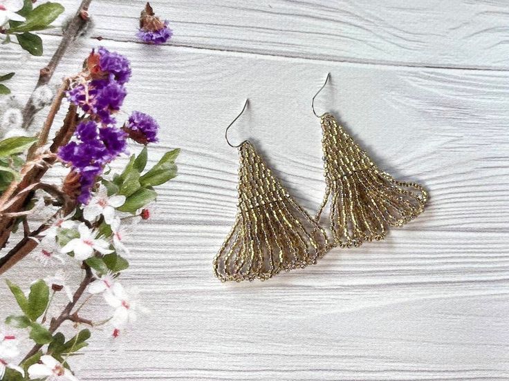 These bright beaded earrings are made from selected Czech beads. Fringe beaded earrings can be an excellent personalized gift for birthdays, Mother's Day, bridesmaids, Valentine's Day, Wedding day, Christmas, New Year, and for your loved ones. ♡ Length - 2.4'' (6 Centimeters) ♡ Width - 0.8'' (2 Centimeters) ♡ Quality Czech beads ♡ Stainless steel/925 Silver Hooks The colors can slightly differ from the photo because of photography lighting and monitor settings. ♥Gift packaging - FREE! NOTE: Before you pay, please make sure the address in your order matches the address you would like me to ship. ♥ Back to my shop: https://www.etsy.com/shop/BohoBeadRoom My Instagram @boho.bead.room Gold Chandelier Earrings With Colorful Beads For Party, Party Dangle Earrings With Bead Caps, Bohemian Silver Earrings With Gold Beads, Party Beaded Earrings With Bead Caps, Gold Beaded Earrings With Bead Caps As Gift, Party Beaded Earrings With Round Beads, Gold Beaded Earrings With Bead Caps For Gift, Elegant Drop Earrings With Bead Caps For Party, Party Bead Caps Drop Earrings