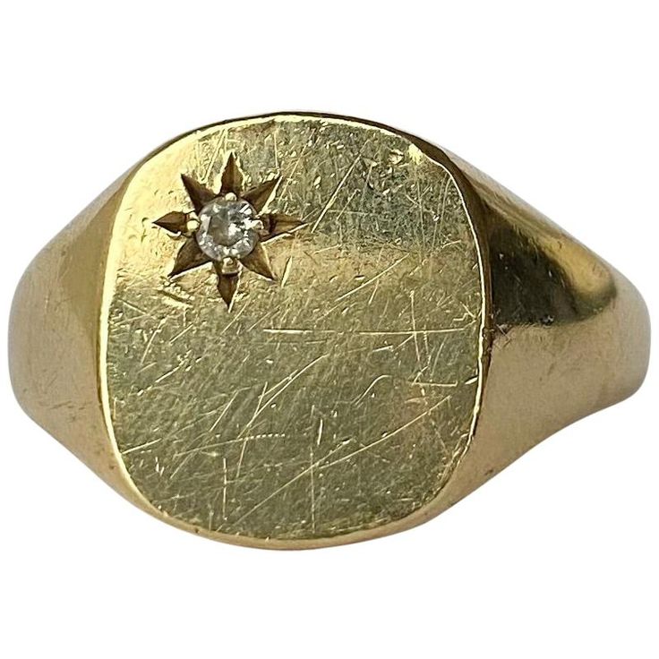 The design of this ring is fabulous! In the top corner of the main panel is a 7pt diamond set within a star setting. Fully hallmarked 1997 Birmingham, England. Ring Size: V 1/2 or 10 3/4 Widest Point: 14mm Weight: 8g Classic Star-shaped Jewelry With Single Diamond, Formal Star-shaped Single Diamond Jewelry, Vintage Star-shaped Anniversary Rings, Classic 14k Gold Star Shaped Signet Ring, Classic Star-shaped Signet Ring With Polished Finish, Classic Star Shaped Signet Ring With Polished Finish, Star-shaped Diamond Anniversary Ring With Accents, Classic Polished Star Shaped Signet Ring, Star-shaped Diamond Ring With Accents For Anniversary