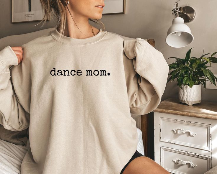 Dance Mom Shirt | Cool Mama Dance Team Sweatshirt | Dance Mom Mother's Day Gift *JUST RELEASED* * Custom Design * Limited Edition * *This item is NOT available in stores* Show your Mom love with this custom, limited edition "dance mom" sweatshirt.  Ideal for any situation, a unisex heavy blend crewneck sweatshirt is pure comfort. These garments are made from polyester and cotton. This combination helps designs come out looking fresh and beautiful. The collar is ribbed knit, so it retains its shape even after washing. There are no itchy side seams on these sweaters.  .: Made with a medium-heavy fabric blend of 50% cotton and 50% polyester (8.0 oz/yd² (271.25 g/m this sweatshirt feels cozy and is the perfect choice for those colder months. .: The classic fit along with the crew neckline deli Dance Parents, Dance Mom Gifts, Dance Mom Shirt, Xmas Gifts For Mom, Cute Dance, Dance Mom Shirts, Birthday Gift Mom, Gift For Mom Birthday, Team Sweatshirts