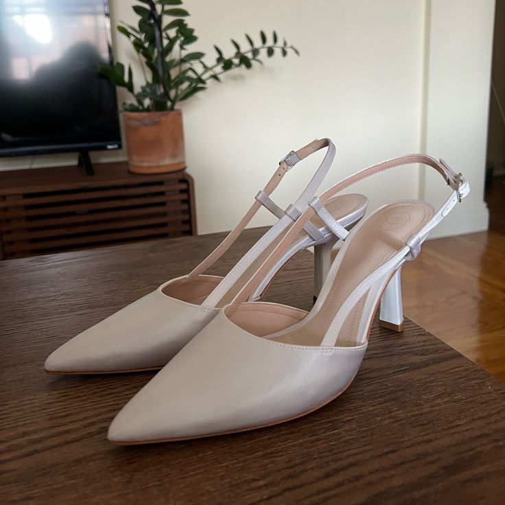 I Got These Shoes For My Wedding, They Are Italian Size 38.5 And Us Size 8.5. Ended Up Wearing Different Shoes, So Selling These. Comes In A Box With Dust Bag. The Heel Is Approx 80mm/3 Inches Classic Cream Slingback Pumps With Ankle Strap, Spring Gala Slingback Pumps With 4-inch Heel, Elegant Cream Slingback Pumps With 4-inch Heel, Cream Fitted Slingback Pumps, Fitted Cream Slingback Pumps, Summer Gala Wedding Shoes With Pointed Toe, Elegant Cream Slingback Pumps For Spring, Cream Slingback Pumps With Heel Strap And Almond Toe, White Ankle Strap Slingback Pumps For Gala