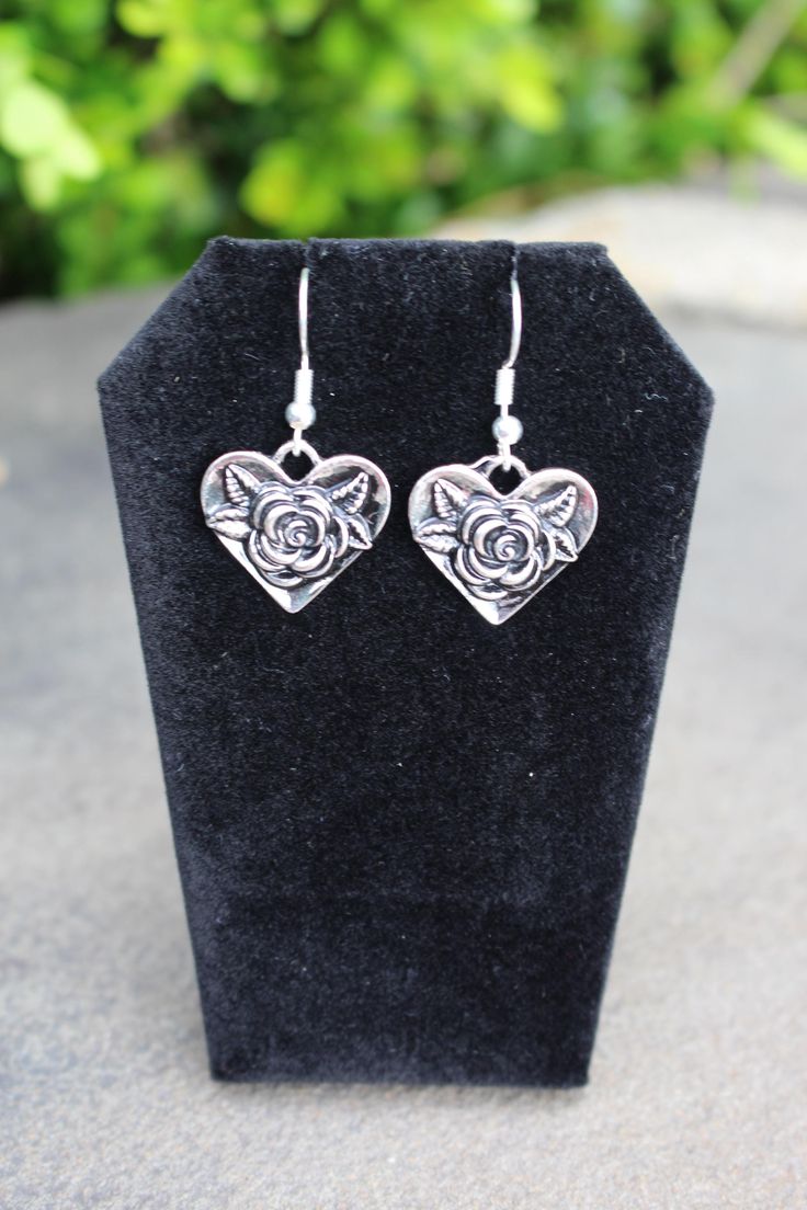 Silver heart-shaped rose earrings Rose Flower Drop Earrings For Valentine's Day, Heart-shaped Earrings For Mother's Day, Valentine's Day Heart-shaped Flower Earrings For Pierced Ears, Nickel-free Heart Pendant Earrings For Valentine's Day, Rose Earrings For Valentine's Day, Silver Heart-shaped Jewelry With Rose Design, Valentine's Day Dangle Jewelry With Rose Design, Rose Valentine's Day Earrings Gift, Valentine's Day Rose Design Earrings Gift