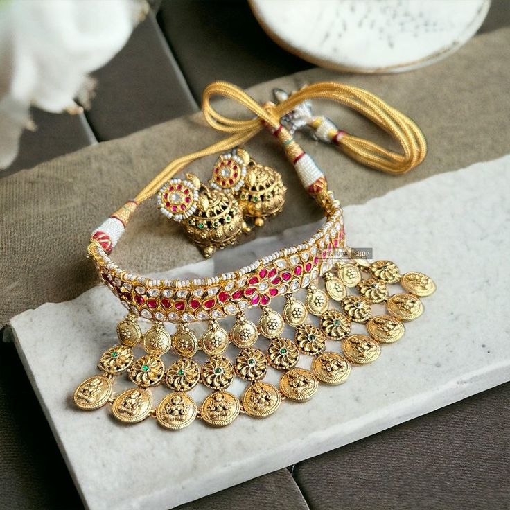 Ruby White Gold plated 1gm Lakshmi choker ethnic temple necklace set.    . Temple Necklace, American Diamond Necklaces, Necklace Set Indian, Oxidized Necklace, Western Earrings, Ethnic Necklaces, Polki Jewellery, Kundan Necklaces, Ethnic Earrings