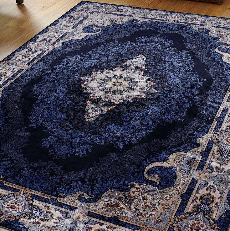 a blue rug with an ornate design on it