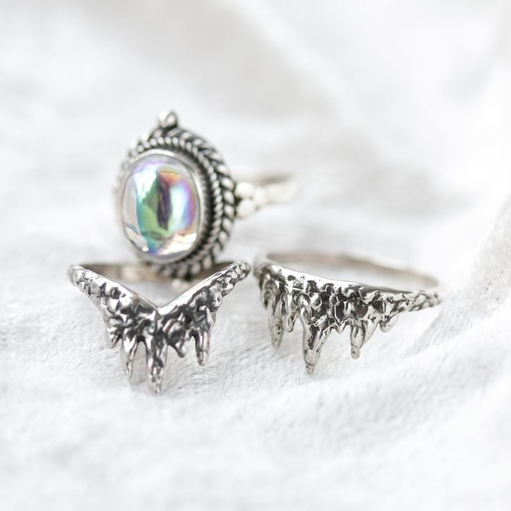 Meet the magical Shop Dixi sterling silver wishbone icicle / fire inspired ring. Watch the Ice Queen rise from her throne of ice, adorned with magical jewels to unleash her firey strength and beauty across her realm. MaterialSterling SilverSizingRing Front - Height 9mm