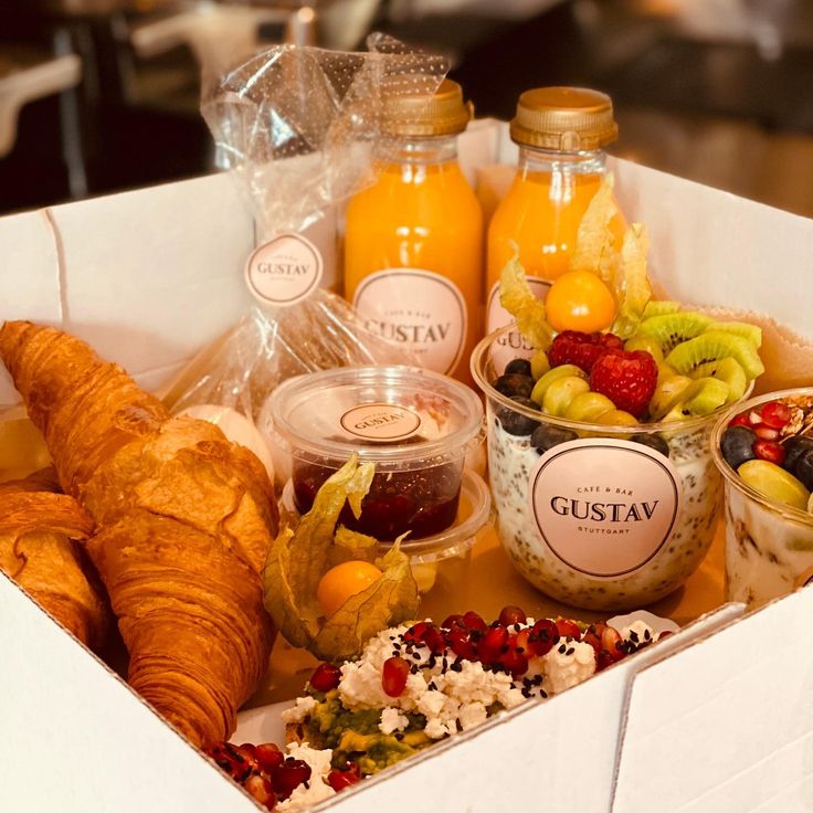 a box filled with lots of different types of food and condiments on top of it