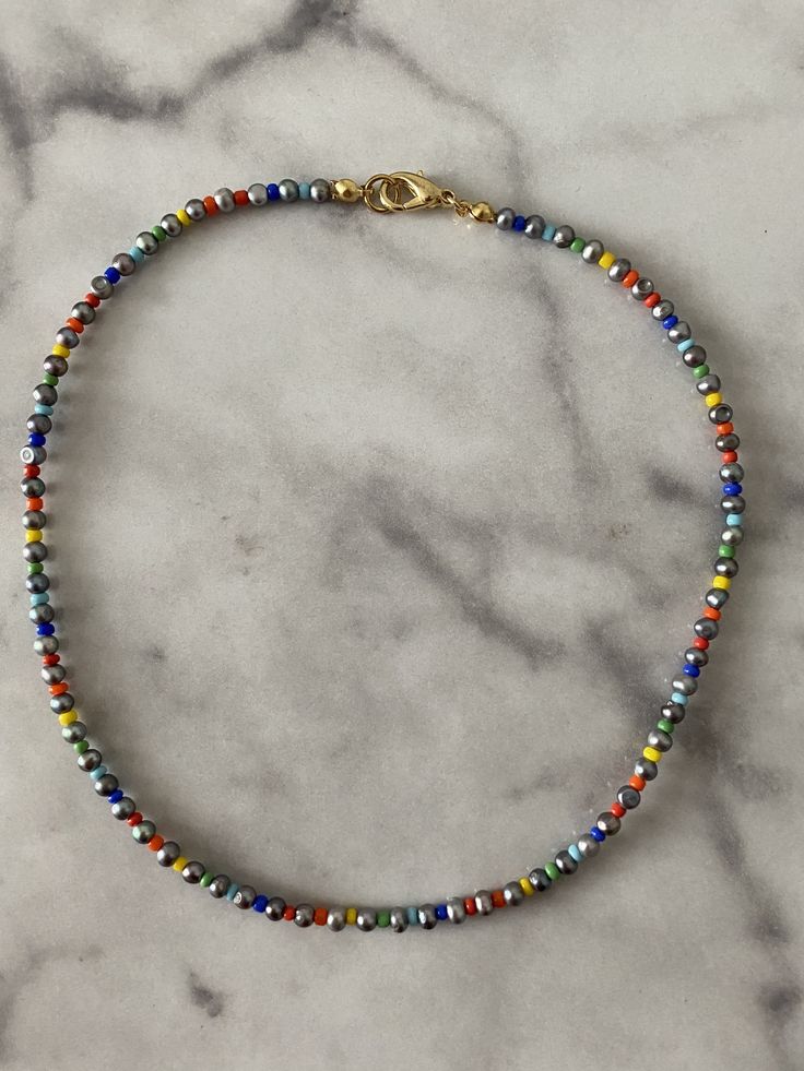 multicolored beaded bracelet on marble surface