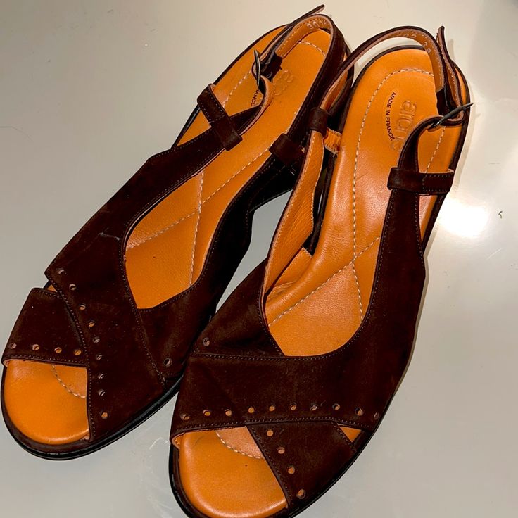 Like New, Super Comfortable Arche Nubuck Calfskin Brown Suede Sandals With 2.75” Wedge. Size 39 (French), 8m Us. Worn Once! Very Slight Smudge (See Photo) - I Chose Not To Try To Remove It. Bought For An Occasion - Never Worn Since. Ankle Strap, Pretty Perforation Detail. Color Is A Rich Chocolate Brown. Brown Wedge Heel Sandals For Formal Occasions, Brown Sandals With Ortholite Insole, Brown Wedge Sandals With Ortholite Insole For Summer, Summer Brown Wedge Sandals With Ortholite Insole, Casual Leather Wedge Sandals With Low Heel, Brown Sandals With Ortholite Insole And Wedge Heel, Brown Wedge Heel Sandals With Ortholite Insole, Brown Open Toe Wedge Sandals For Formal Occasions, Formal Brown Wedge Sandals With Open Heel