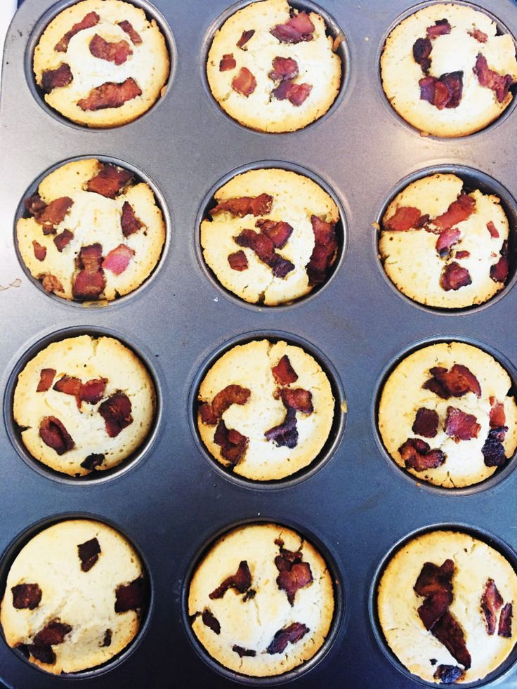 muffins with bacon are in a pan ready to be baked