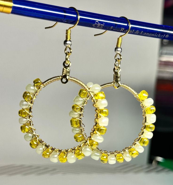 Handcrafted beaded hoop earrings made from glass beads and non tarnish brass. Glass Hoop Earrings As Gift, Glass Hoop Earrings For Gift, Handmade Metal Hoop Earrings With Round Beads, Gold Beaded Metal Hoop Earrings As Gift, Wire Wrapped Round Beaded Earrings, Small Hoop Wire Wrapped Beaded Earrings As Gift, Glass Hoop Earrings Gift, Gift Small Hoop Beaded Earrings Wire Wrapped, Gold Beaded Glass Earrings