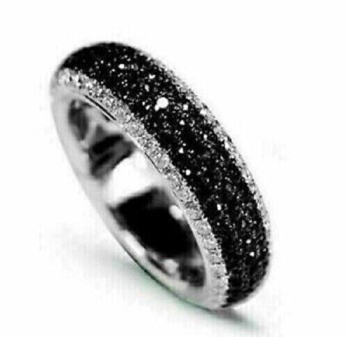 a black and white ring with sparkles on the inside, set in 18k white gold