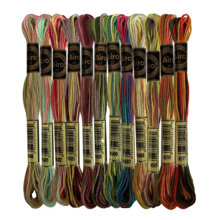 six skeins of multicolored cotton thread in different sizes and colors, each with