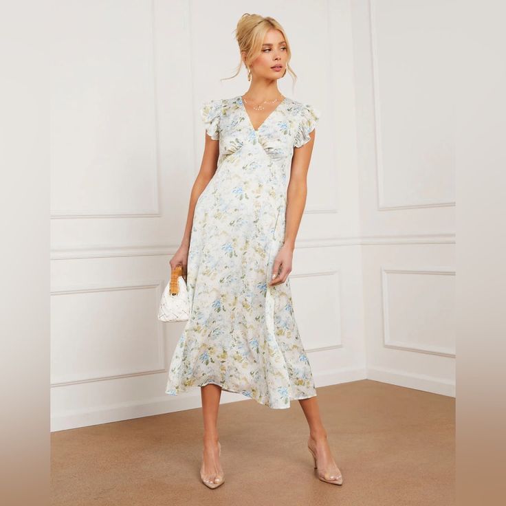 - Ruffled Short Sleeves - V-Neckline - Floral Print - Midi Length - Back Tie Detail - Self: 98% Polyester 2% Spandex, Lining: 100% Polyester V-neck Maxi Dress For Daytime, Fitted V-neck Maxi Dress For Daytime, White V-neck Surplice Neckline Dress For Brunch, Feminine Midi Dress With Surplice Neckline For Brunch, Feminine Surplice Neckline Midi Dress For Brunch, Chic V-neck Maxi Dress For Daytime, White V-neck Dress For Spring Garden Party, White V-neck Dress For Garden Party In Spring, White Floral Print Midi V-neck Dress