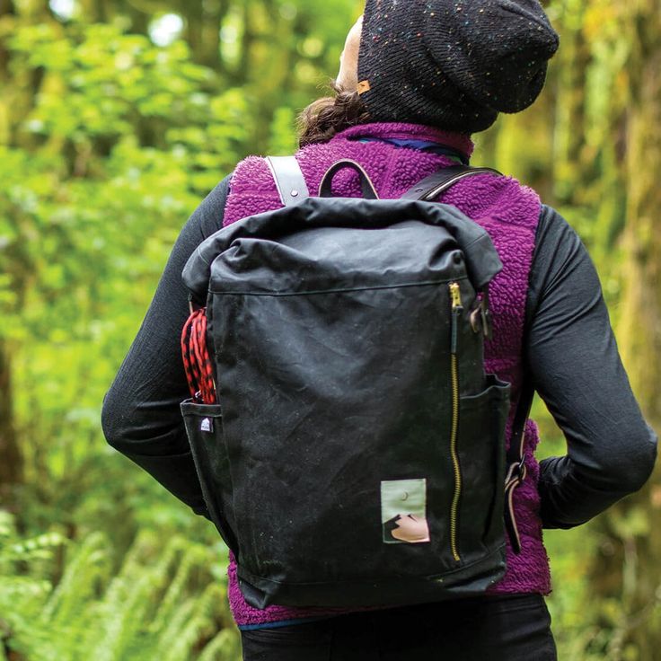 a person with a backpack in the woods