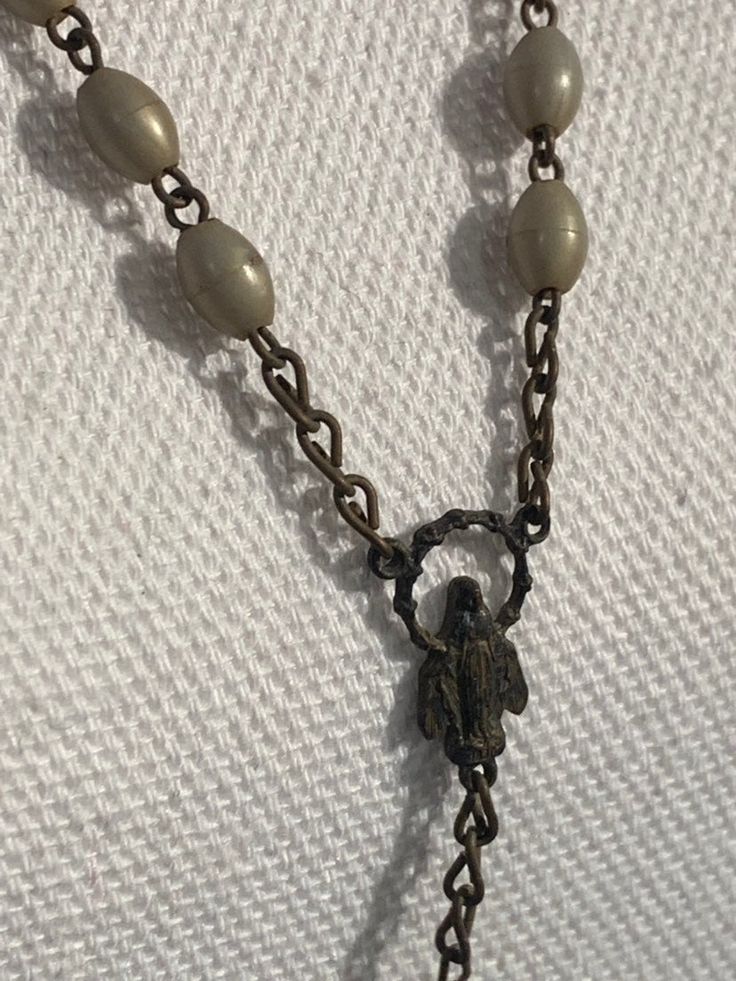 Vintage Italy Rosary Mother of Pearl Crucifix Antique Plastic Beads This is a antique item therefore they may show some time wear or imperfections adding to authentic character. Makes a great one of a kind gift for that special person! Message me with any questions. Vintage Gold Beaded Necklaces With 8mm Beads, Large Vintage Beads For Jewelry Making, Vintage Beaded Chain Beads As Gift, Vintage Spacer Beads Gift, Vintage Oval Beaded Necklaces For Jewelry Making, Vintage Oval Beaded Jewelry, Vintage Beaded Chain Necklaces, Vintage Silver Rosary With Round Beads, Vintage Beaded Rosary As Gift