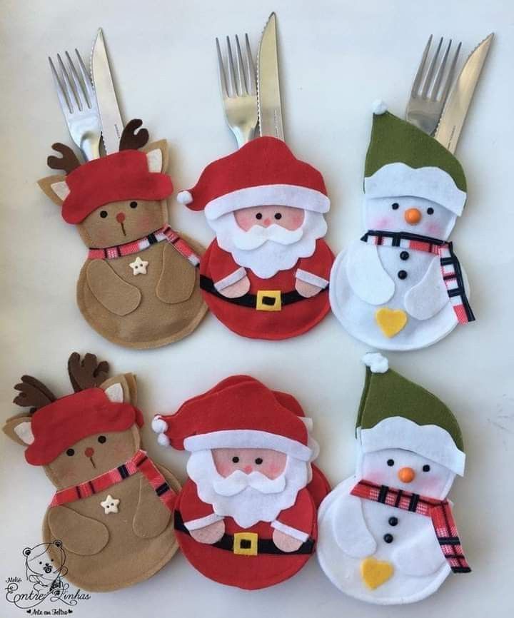 four christmas themed forks with santa claus and snowmen on them