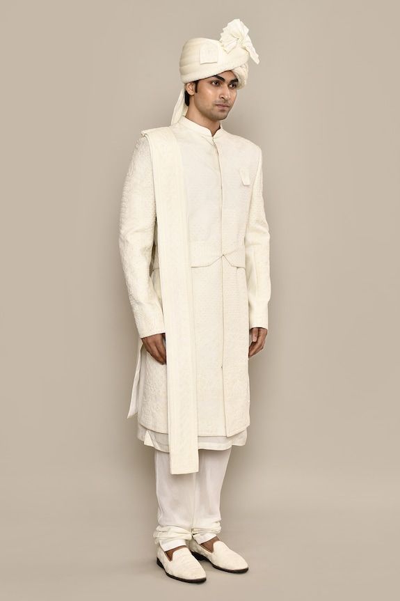 Ivory sherwani with thread, french knots embroidery in diamond pattern. Paired with kurta, churidar, dupatta and belt. Comes with safa, juttis, sevra and tanni. - Aza Fashions Designer Sherwani With Dupatta For Reception, Off White Raw Silk Kurta For Reception, Cream Nehru Jacket With Naqshi For Reception, Formal Off White Kurta With Cutdana, Designer Nehru Jacket With Dupatta For Wedding, Designer Wedding Kurta With Dupatta, Formal Off-white Kurta With Cutdana, Formal Cream Nehru Jacket With Chikankari Embroidery, White Sherwani With Cutdana For Formal Occasions