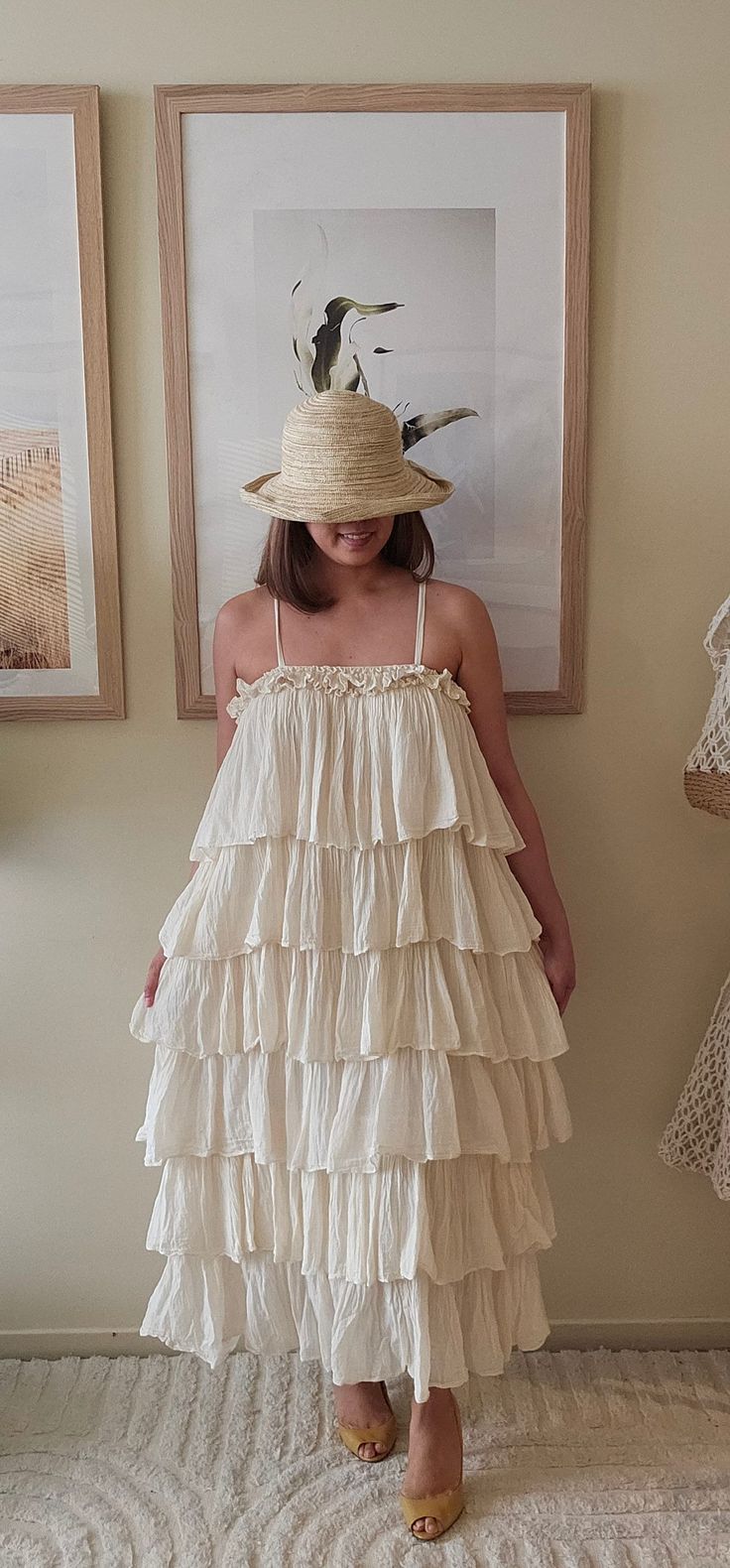 This handmade Bohemian dress is crafted from 100% organic cotton. Its flowing silhouette and tiered layers embody a free-spirited charm, making it a perfect choice for warm days while promoting sustainable craftsmanship. Bohemian Tiered Dress With Ruffles, Bohemian Tiered Dress With Ruffles For Garden Party, Flowing Cotton Tiered Dress For Beach, Flowy Cotton Tiered Beach Dress, Flowy Cotton Tiered Dress For The Beach, Tiered Boho Dress With Ruffles For Vacation, Bohemian Flowy Tiered Dress With Ruffle Hem, Spring Boho Tiered Dress With Ruffles, Flowy Tiered Cotton Dress With Ruffle Hem