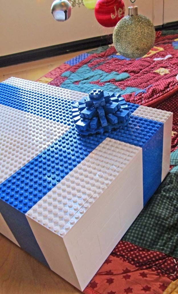 a blue and white gift box sitting on top of a rug