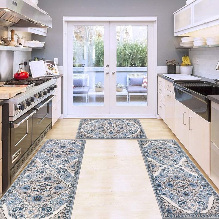 the kitchen is clean and ready to be used for cooking or eating, with an area rug on the floor