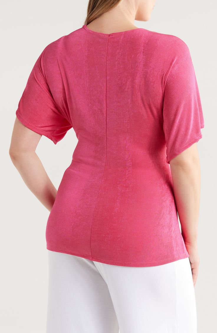 A twisted design at the front creates gorgeous shape on this soft jersey top designed with a deeply dipped V-neckline. Deep V-neck Short sleeves 92% polyester, 8% spandex Machine wash, tumble dry Imported Solid Color V-neck Faux Wrap Top, Summer V-neck Twist Front Tops, Stretch V-neck Top With Twist Front, Stretch V-neck Twist Front Top, Stretch Twist Front V-neck Top, Faux Wrap V-neck Top, Solid V-neck Faux Wrap Top, Versatile Pink V-neck Top, Pink Fits